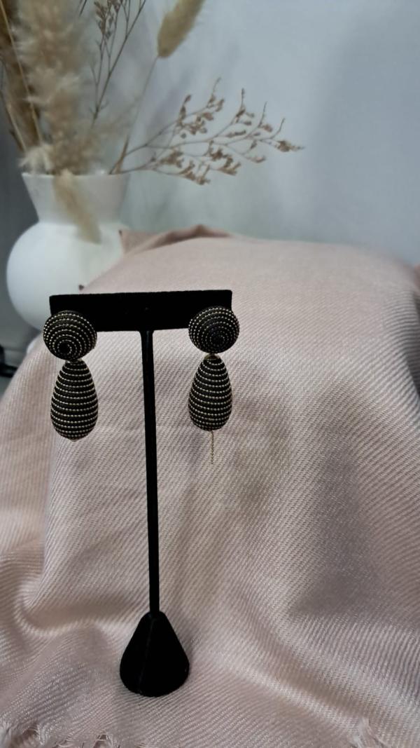 ARETE  NEGRO CON DORADO