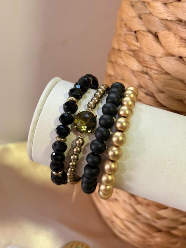 PULSERA DORADO Y NEGRA ETE